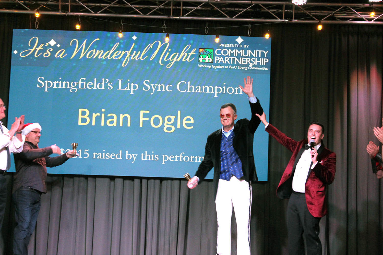 ‘SWEET CAROLINE’
Brian Fogle, CEO of Community Foundation of the Ozarks, is crowned Springfield Lip Sync Champion during Community Partnership of the Ozarks’ It’s a Wonderful Night fundraiser Dec. 6. Other participants included Stephen Hall of Springfield Public Schools, David Pennington of the Springfield Fire Department, Cora Scott of the city of Springfield, Clif Smart of Missouri State University and Paul Williams of the Springfield Police Department. The lip sync battles generated $8,300 worth of votes, with the final between Fogle and Smart bringing in $4,000 in donations. Fogle’s winning song was “Sweet Caroline.”